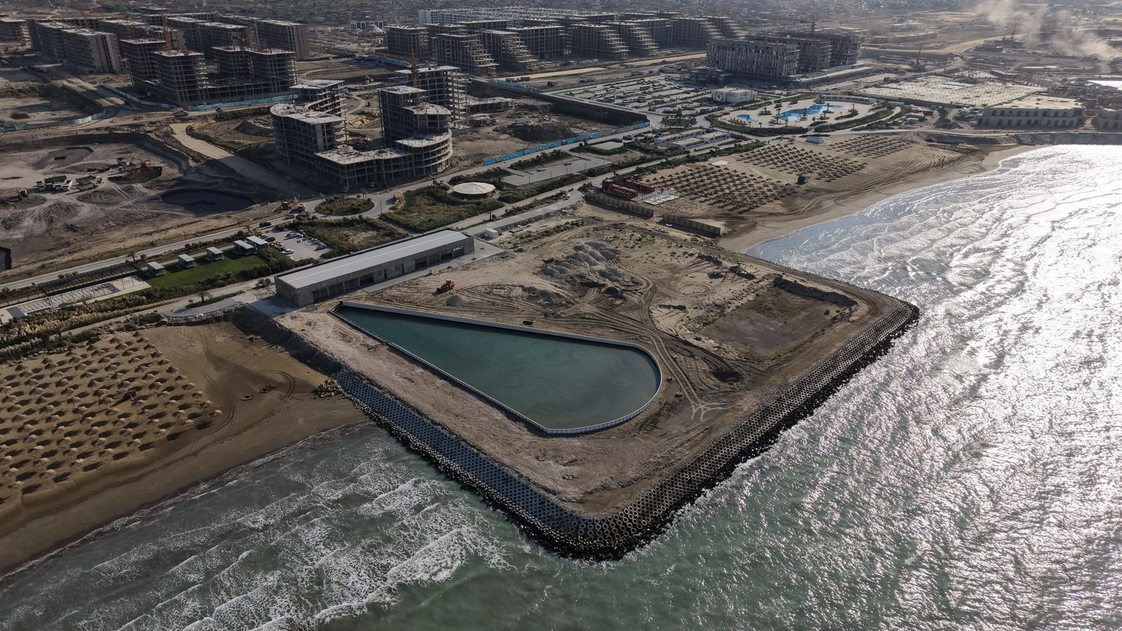 Surf Sea Breeze from above: the wave pool, building and reinforced shoreline